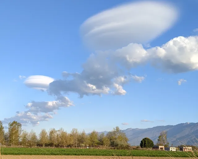 Lenticular clouds over the fields and mountains around Lake Kerkini, seen on a Salty Soil day trip from Thessaloniki