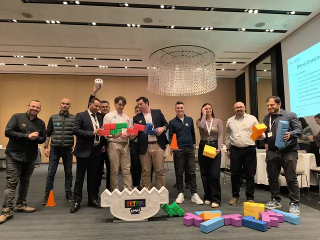 A corporate team laughs while stacking giant Tetris blocks during a Salty Soil team building game in a hotel conference room