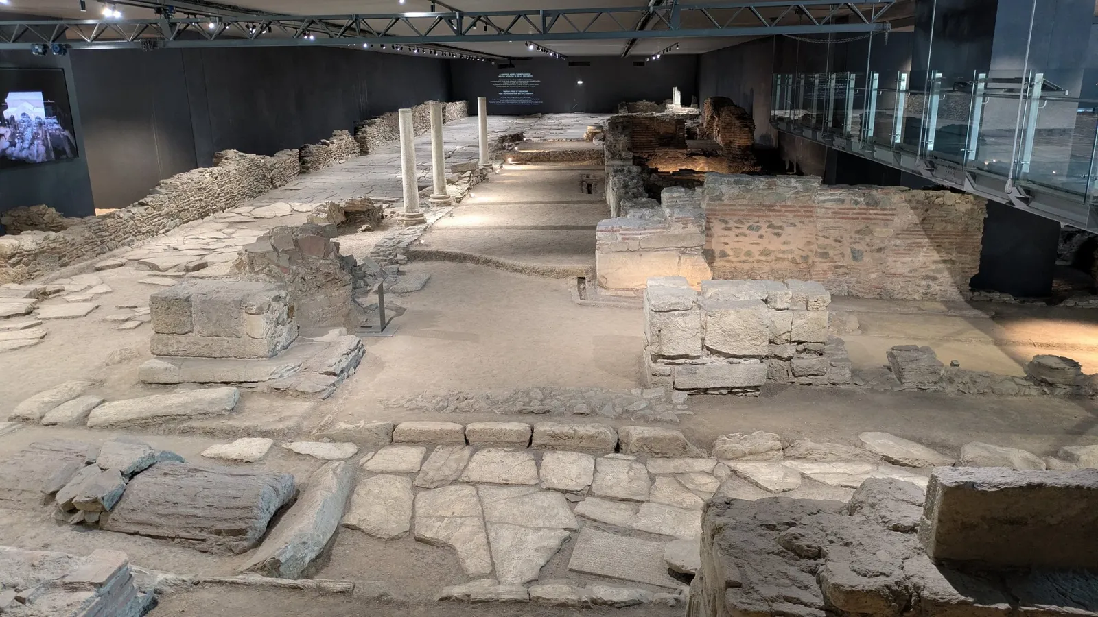 Excavated Roman and Byzantine main street with marble paving, columns and shop walls on display inside Venizelou metro station in Thessaloniki